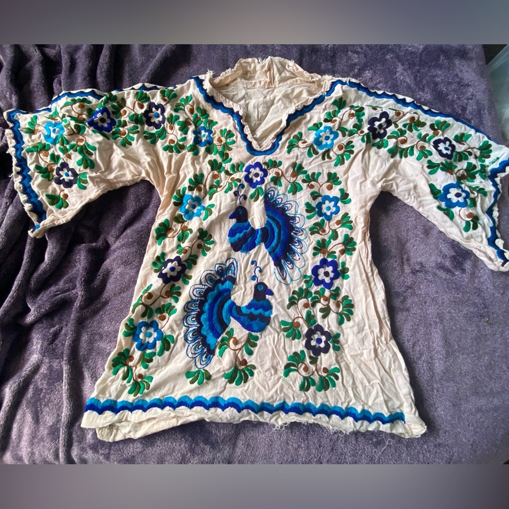 Vintage 1970s tunic shirt embroidered with peacocks.